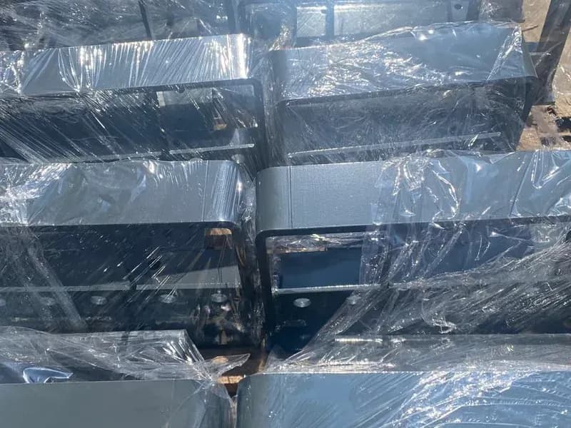 Shrink-wrapped, powder-coated parts of matching size prepared for dispatch