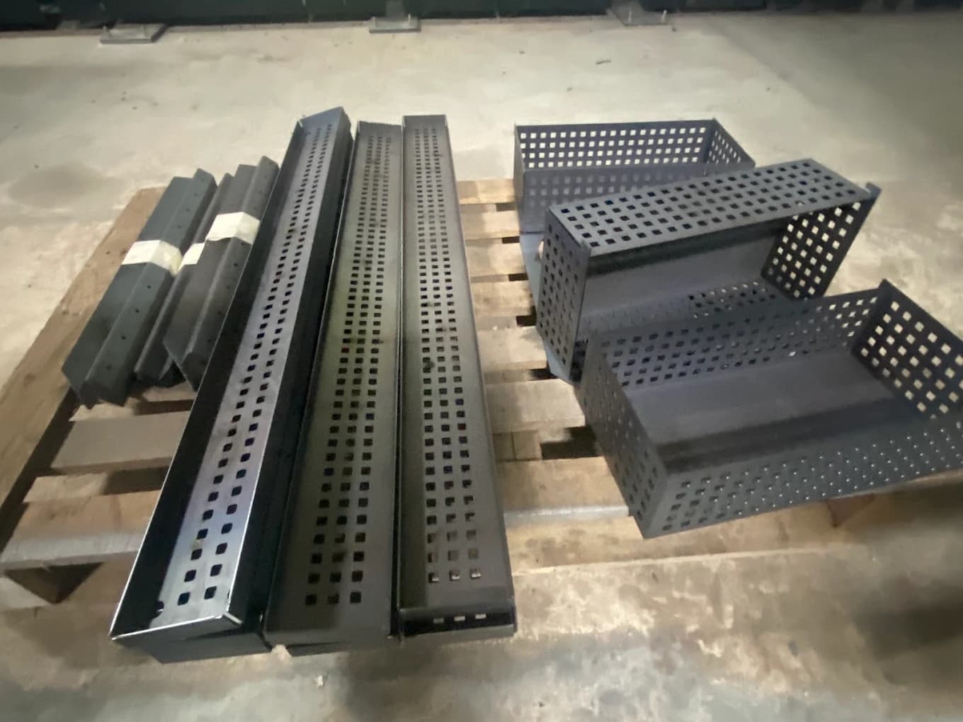 Perforated cable trays and enclosures produced by bending