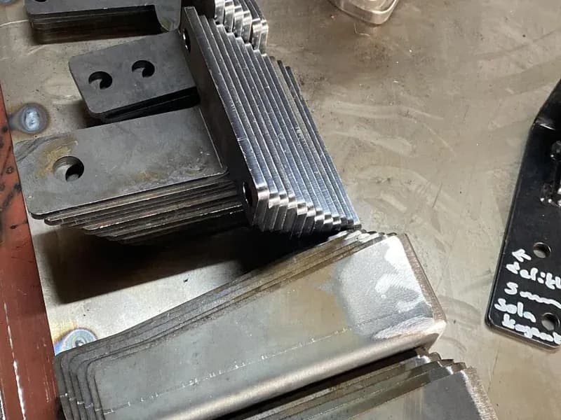 Laser-cut connection parts stacked on the welding table