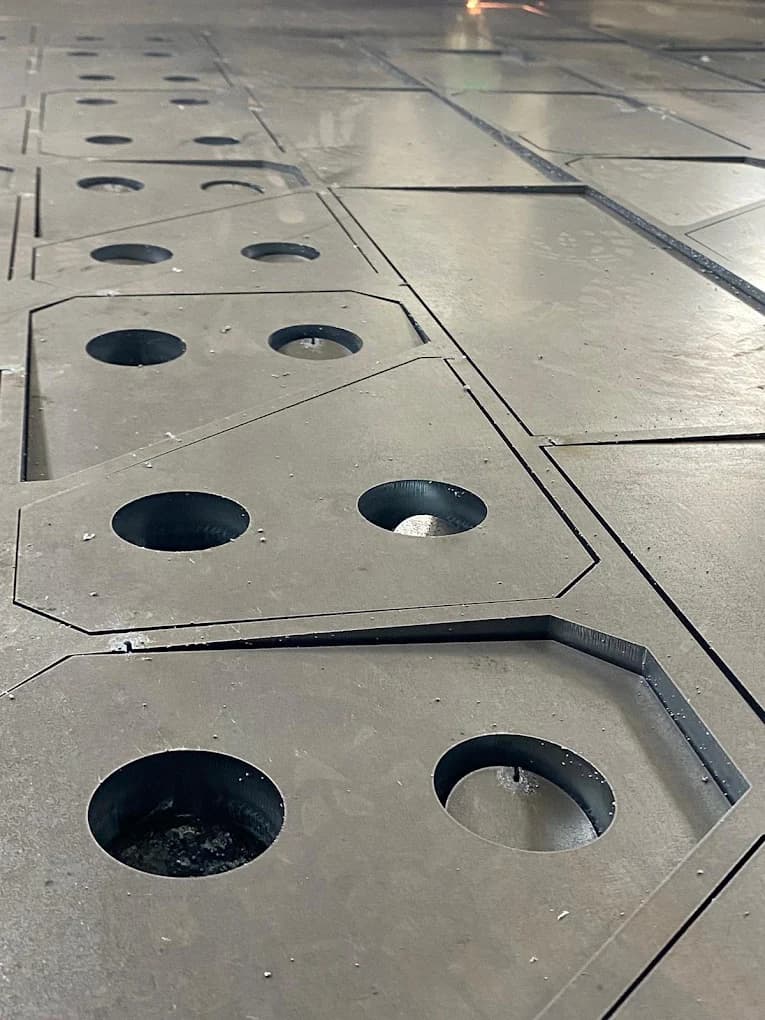 Clean edges of parts cut from a sheet