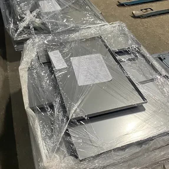 Shrink-wrapped sheet panel parts ready for dispatch