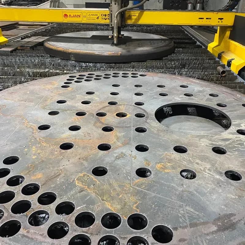 Circular heavy plate boiler tube sheet with holes cut on the plasma machine