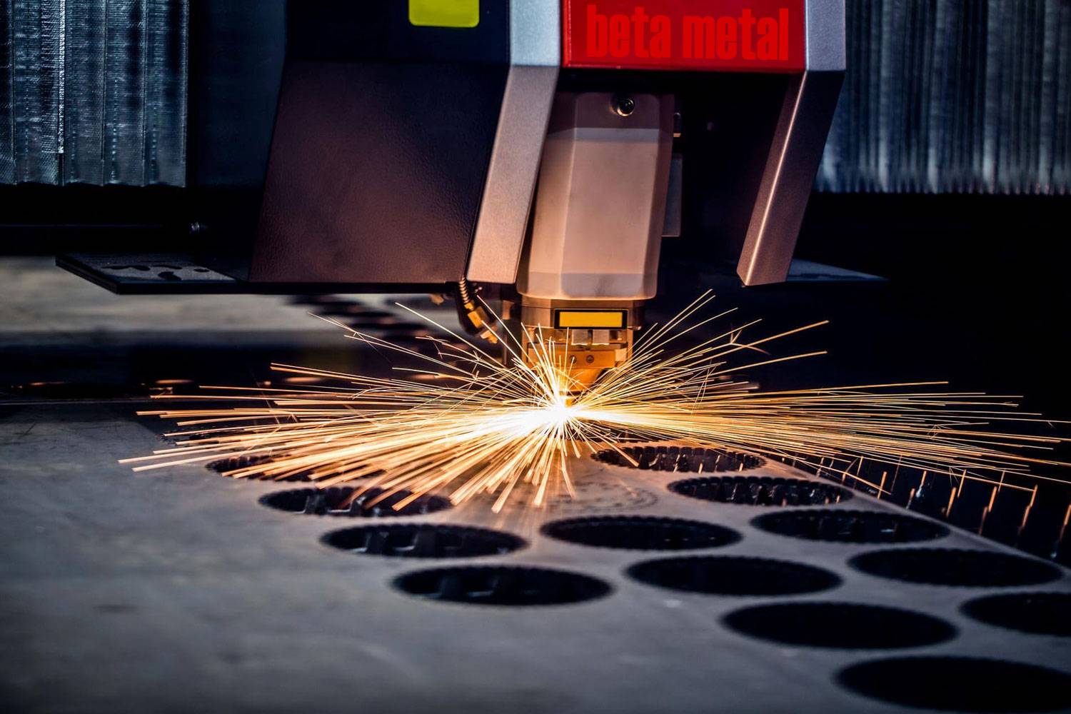 Fibre laser machine cutting a steel plate
